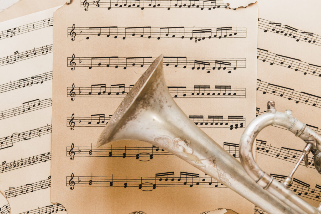 A trumpet resting on sheet music